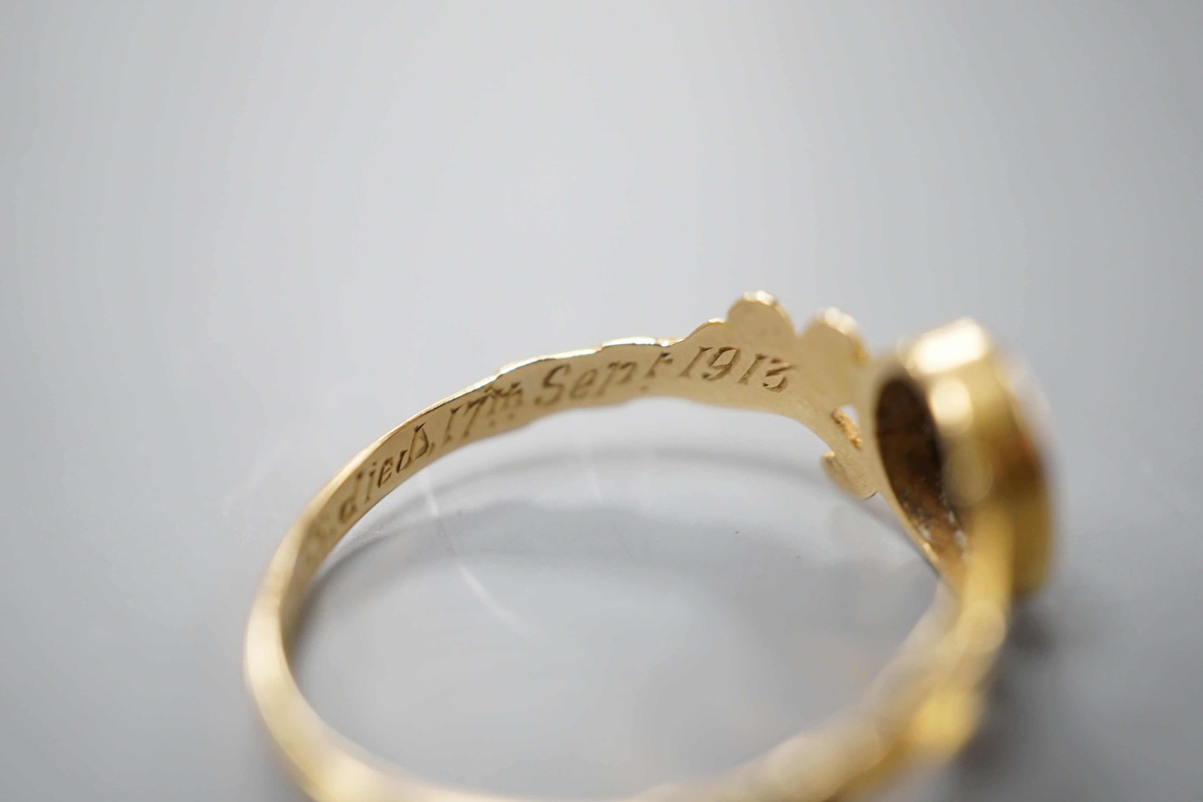 A Victorian 18ct gold, sardonyx and black enamel set mourning, with later engraved inscription, size P/Q, gross weight 2.1 grams, the matrix carved with a cross.